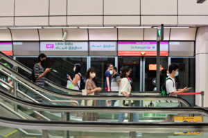 people at the underground train station in singapore